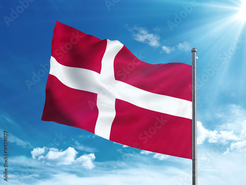 Denmark flag waving in the blue sky