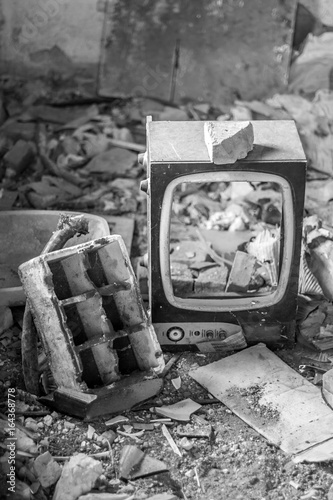 Broken CRT Television Set in abandoned room photo