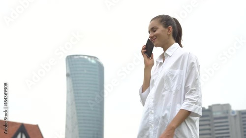 Happy successful emotional woman celebrating bargain, deal photo