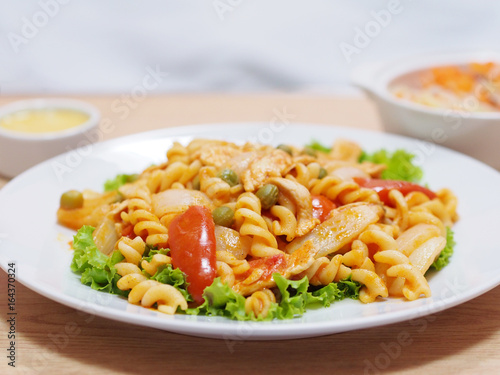 macaroni with tomato sauce on white plate
