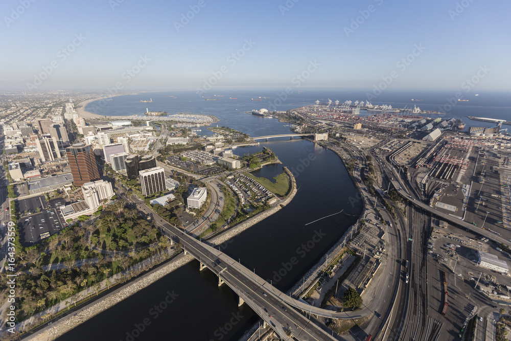 Aerial view of streets, buildings, port facilities and the end of the Los Angeles river in downtown Long Beach, California.   