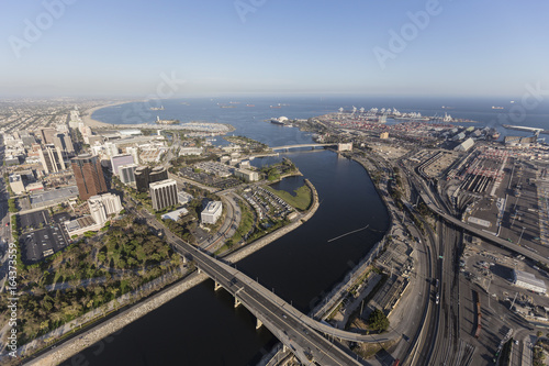Aerial view of streets, buildings, port facilities and the end of the Los Angeles river in downtown Long Beach, California. 