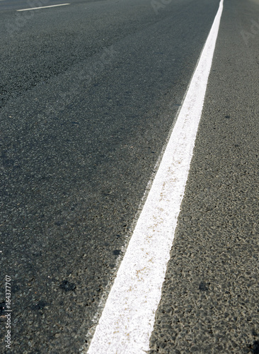 White road marking on asphalt, 