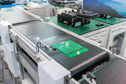 Obraz na płótnie PCB Processing on CNC machine,Production of electronic components at high-tech factory
