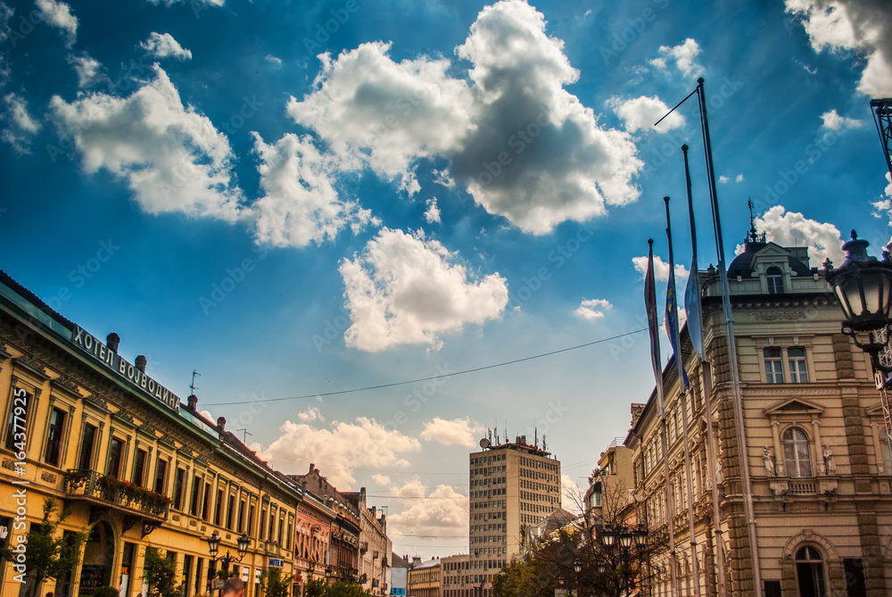 Novi Sad, Serbia - June 15, 2012: Facades of buildings in the center of Novi Sad, Serbia, with blue sky and white clouds, sunny day