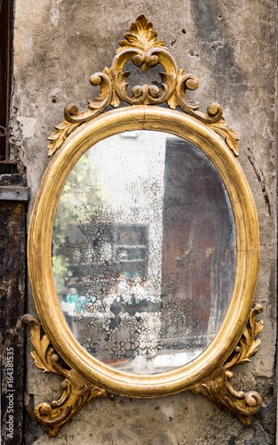 Classic antique mirror with gilded frame © isaac74