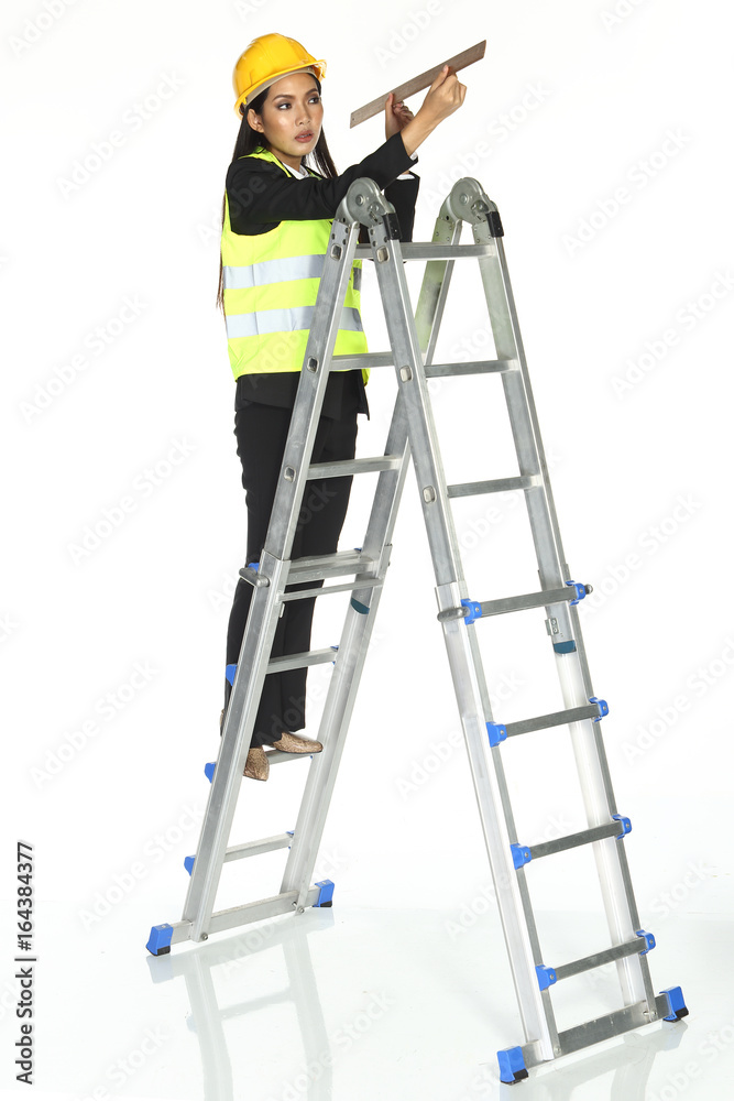 Tall Ladder stair and hit something with hammer. concept woman can fix Tall Ladder stair and hit something with hammer. concept woman can fix