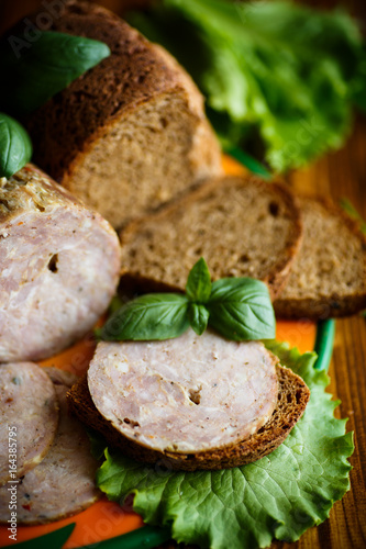 A sandwich with homemade sausage and rye bread