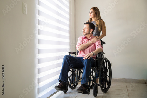 Disabled man getting comforted