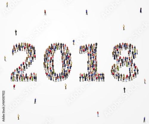 Large and diverse group of people seen from an aerial perspective, gathered together in the shape of number 2018.
