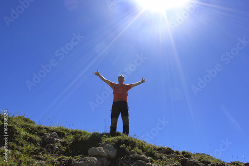 Man feeling happiness in the high of a mountain
