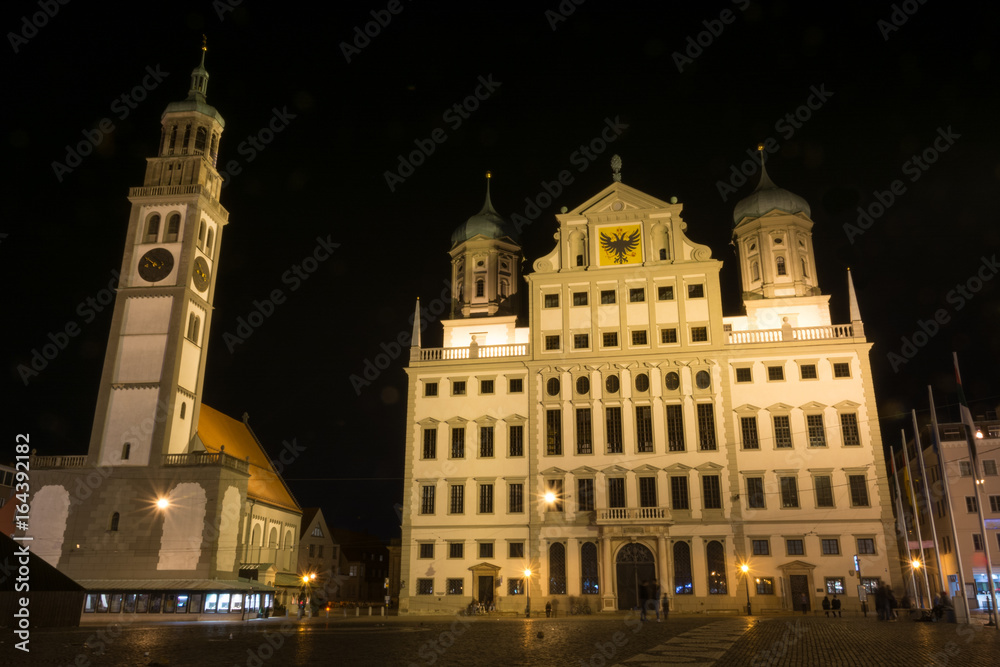 The town hall and church St. Peter of Augsburg, Germany during the night
