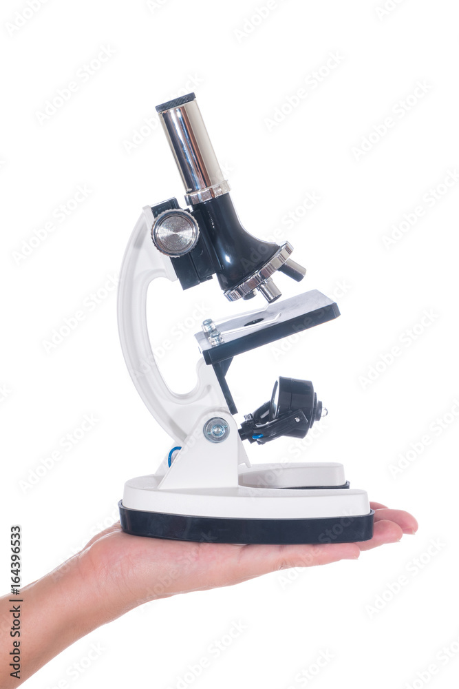 Female hand holding white science microscope isolated on white background Female hand holding white science microscope isolated on white background