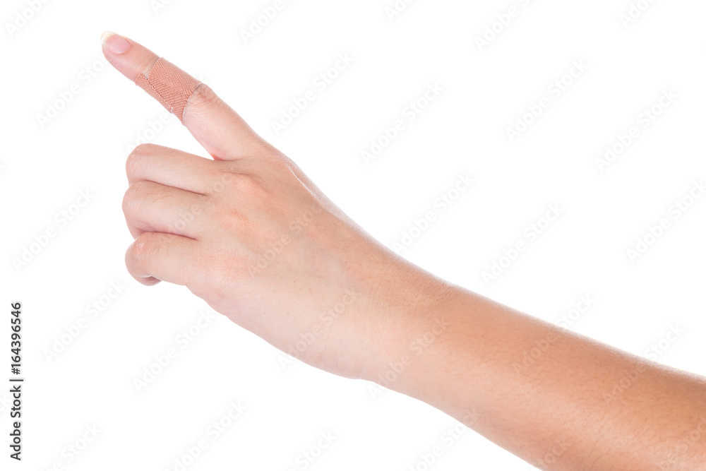 adhesive plaster on woman finger isolated on white background adhesive plaster on woman finger isolated on white background