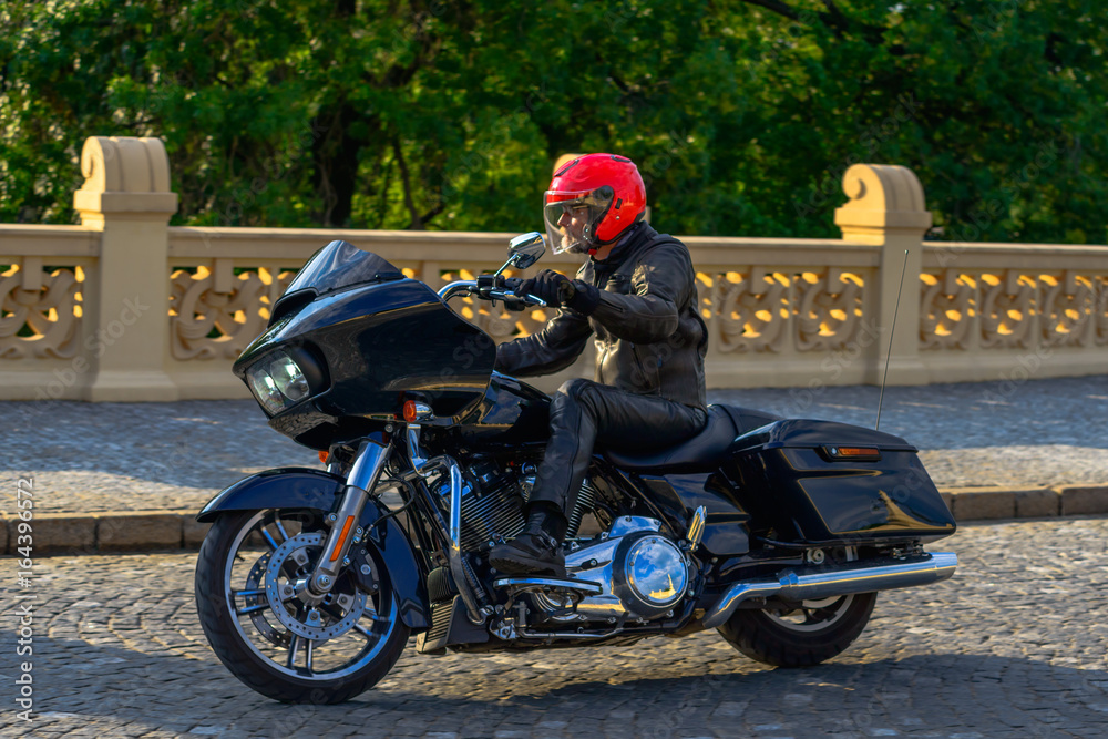 Obraz premium Rider on black custom motorbike 