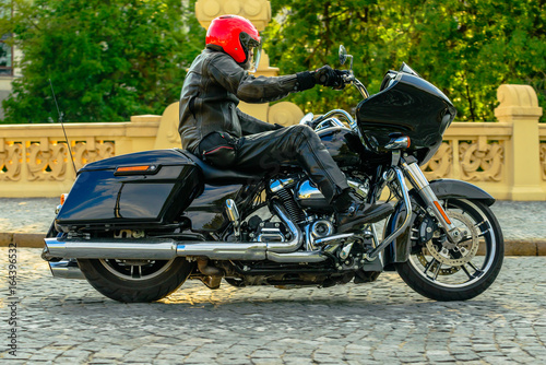 Rider on black custom motorbike  photo