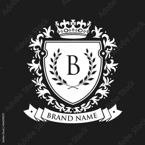 Heraldic emblem shield with crown and laurel wreath. Coat Arms Vintage Brand Crest Heraldic Emblem Shield. Vector illustration