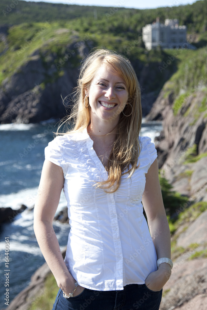 A smiling woman in Logie Bay in Newfoundland in Canada. A smiling woman in Logie Bay in Newfoundland in Canada.