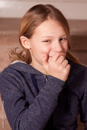 Фотография a girl covering a secret smile
