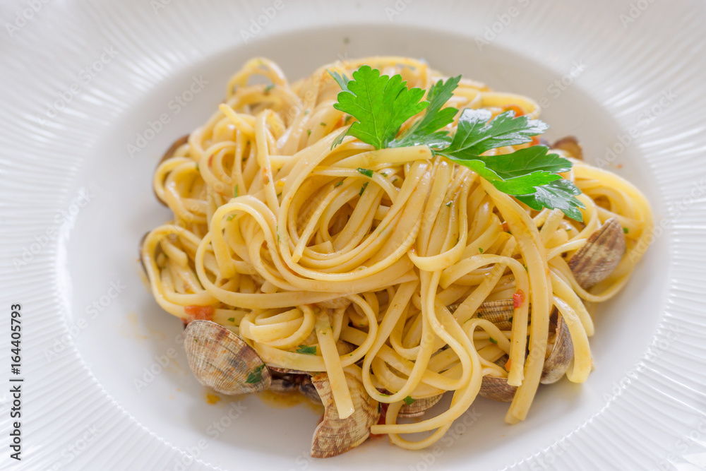 Close up Italian seafood pasta in white plate Close up Italian seafood pasta in white plate