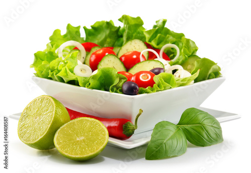 Fotografie Vegetable salad bowl isolated on white