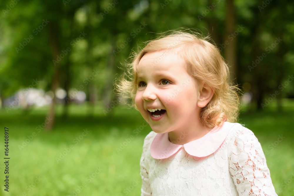 Beautiful child goes in for sports in the summer. Green nature background Beautiful child goes in for sports in the summer. Green nature background