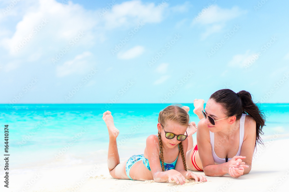Familly on tropical beach. Mom and kid enjoy their vacation Familly on tropical beach. Mom and kid enjoy their vacation