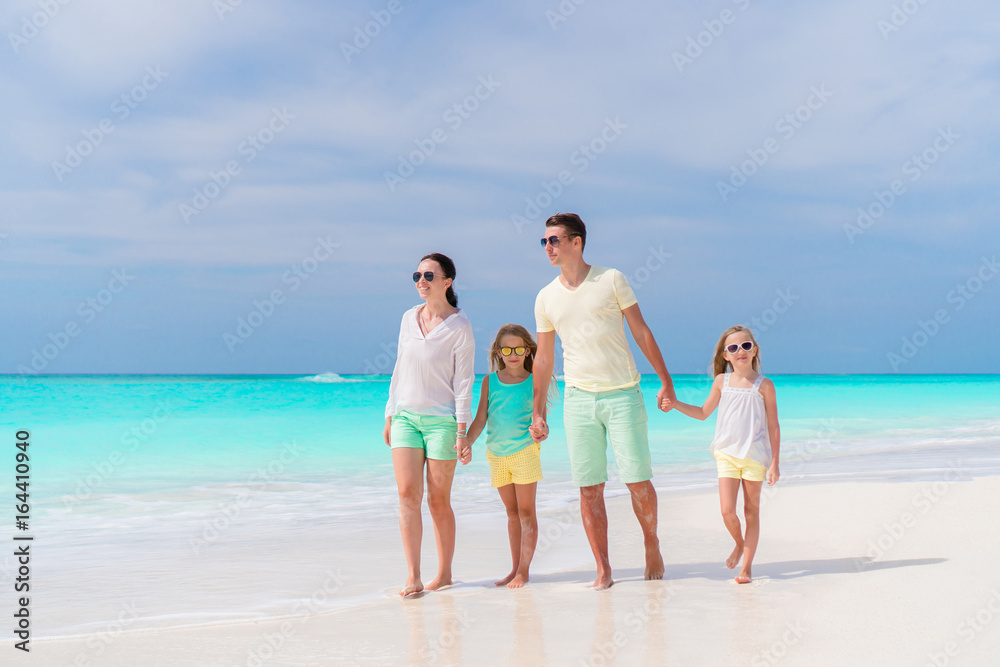 Young family on vacation on the beach. Family travel concept