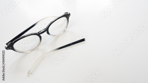 Broken glasses on white background