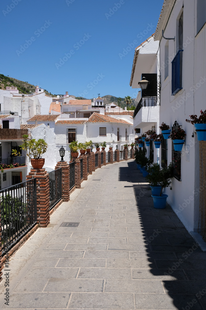 MIJAS, ANDALUCIA/SPAIN - JULY 3 : View of Brick Piers and Blue Flower Pots in Mijas   Andalucía Spain on July 3, 2017