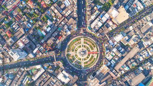 Aerial view, Road roundabout, Expressway with car lots in the city in Thailand. beautiful Street , downtown, cityscape, Top view. Background