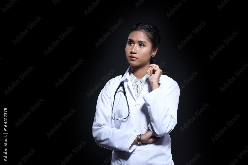 Asian Tan Skin Woman Doctor in White Shirt suit with stethoscope on neck Asian Tan Skin Woman Doctor in White Shirt suit with stethoscope on neck