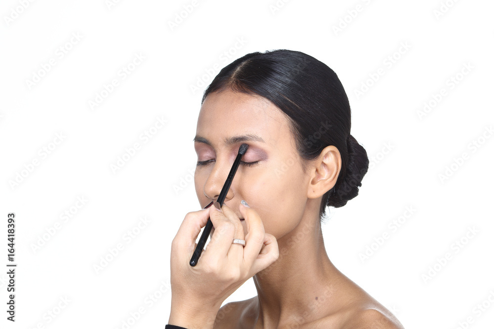Asian Tan Skin Woman wtih Hand On applying cosmetic, Start from fresh face to finish process, studio lighting white background isolated copy space, Series pack photo Asian Tan Skin Woman wtih Hand On applying cosmetic, Start from fresh face to finish process, studio lighting white background isolated copy space, Series pack photo