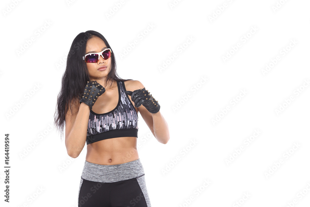 Tan Skin Asian Fitness Girl in Gray Camouflage Sport Bra black spandex pants, stud gloves and sunglasses Exercise boxing warm up in white studio room,