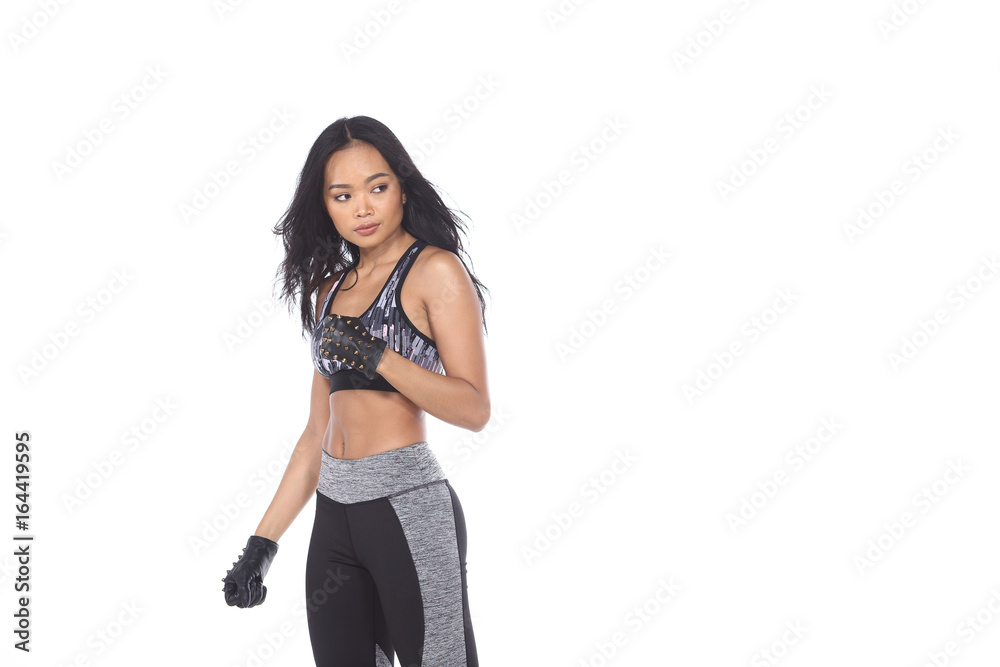 Tan Skin Asian Fitness Girl in Gray Camouflage Sport Bra black spandex pants, stud gloves and sunglasses Exercise boxing warm up in white studio room, Tan Skin Asian Fitness Girl in Gray Camouflage Sport Bra black spandex pants, stud gloves and sunglasses Exercise boxing warm up in white studio room,