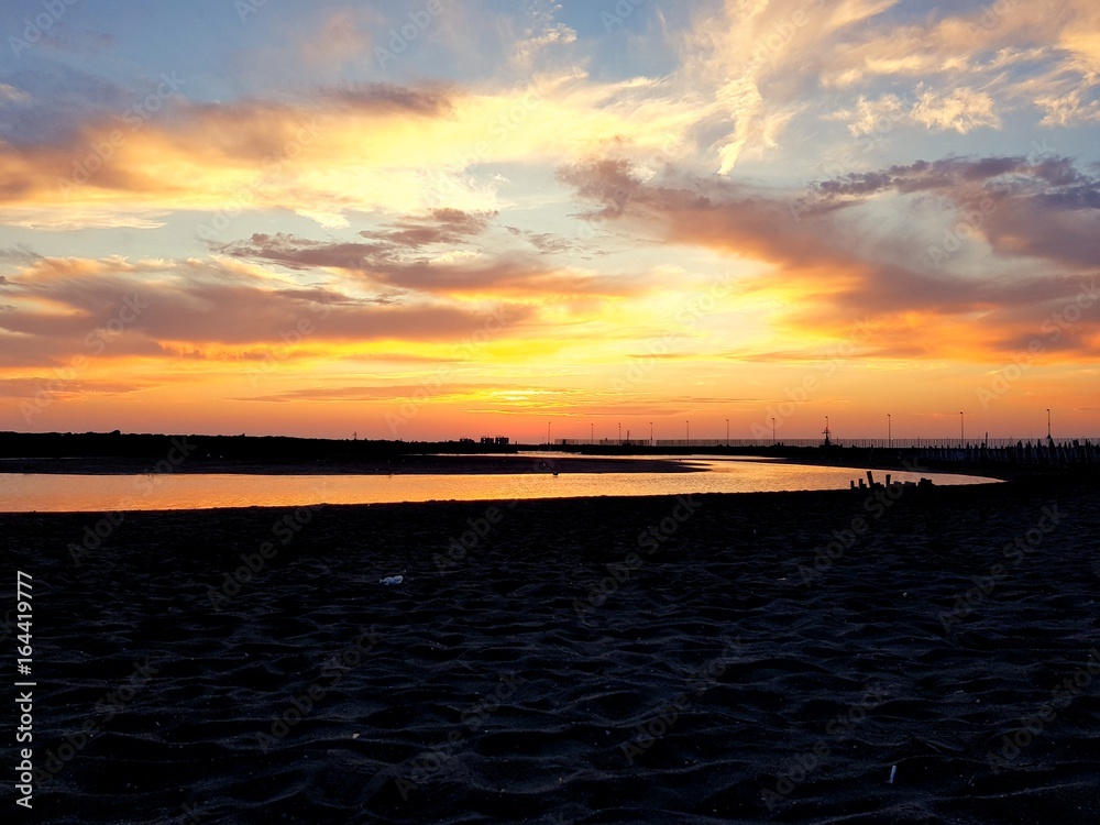 Naklejka premium Tramonto mare