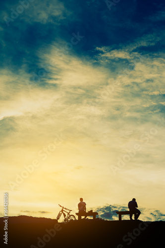 silhouette of people in sunset time © coffmancmu