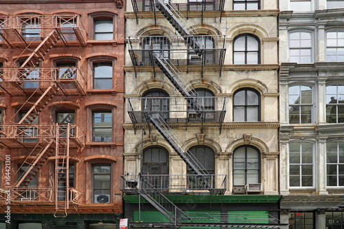 New York apartment building facades with external fire escape ladders © Spiroview Inc.