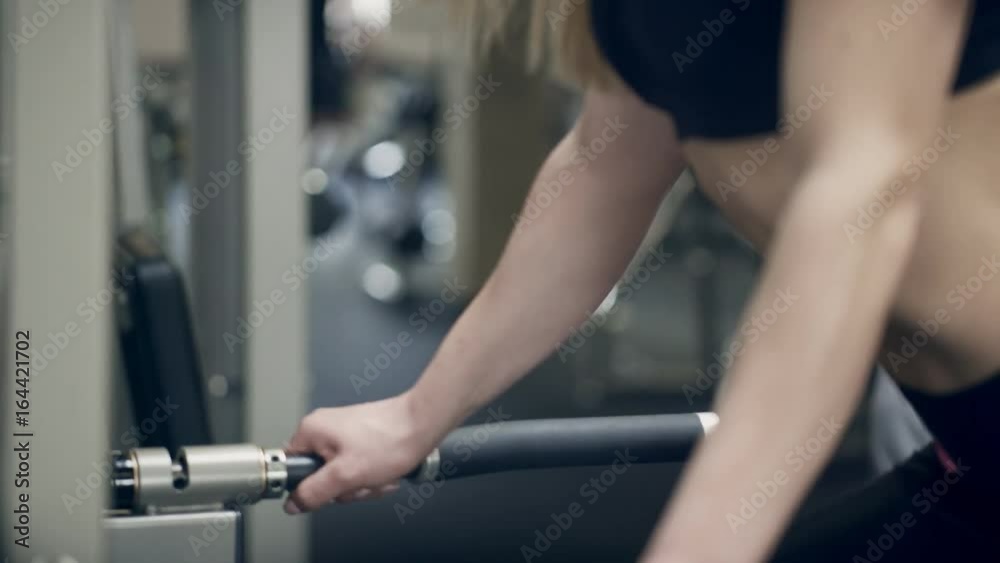 Athlete man and woman training in gym indoor. Young blonde and tattooed male professionally engaged in bodybuilding are preparing for international fitness competitions. People in excellent physical Athlete man and woman training in gym indoor. Young blonde and tattooed male professionally engaged in bodybuilding are preparing for international fitness competitions. People in excellent physical