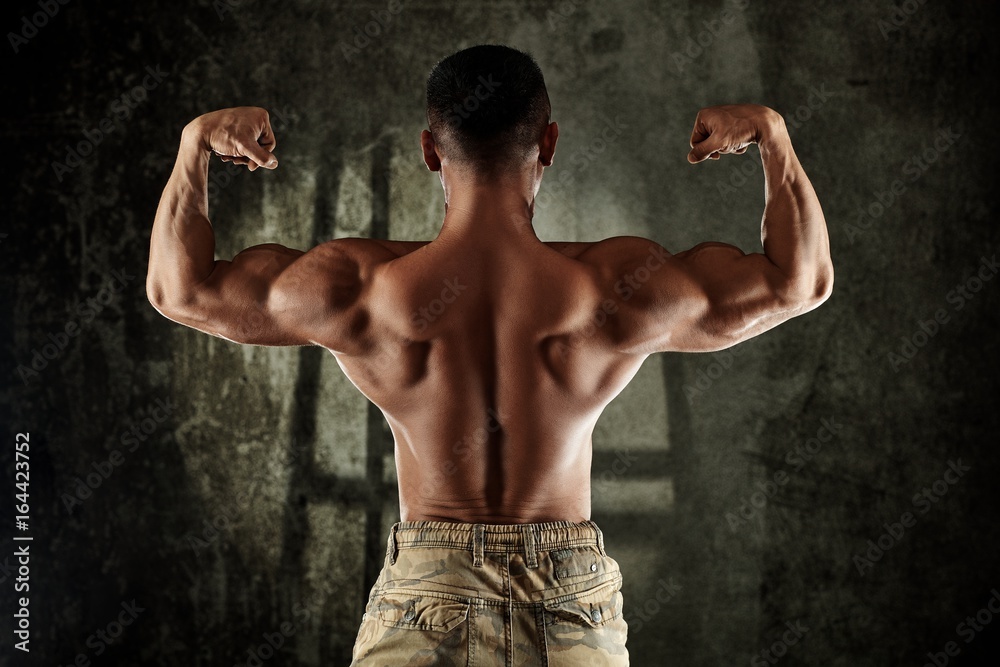 Male bodybuilder showing back muscles