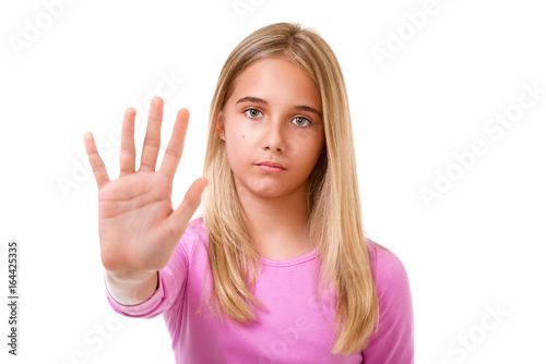 Picture of young lovely girl making stop gesture.Isolated