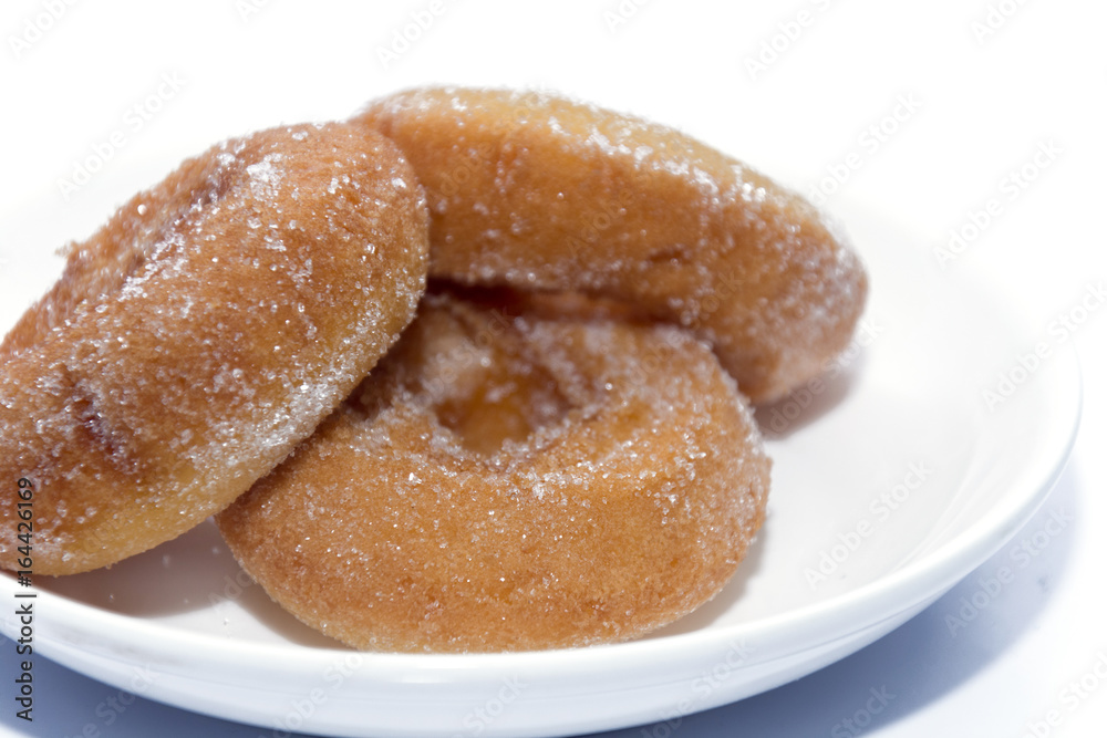 donut on white plate isolated on white donut on white plate isolated on white