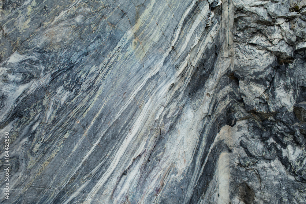 A large rock of grey marble. The texture of the marble. Natural Stone pattern. Natural Stone texture. Natural Stone background. Porcelain textures. A large rock of grey marble. The texture of the marble. Natural Stone pattern. Natural Stone texture. Natural Stone background. Porcelain textures.