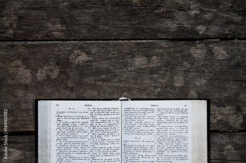 Bible on a wooden desk.