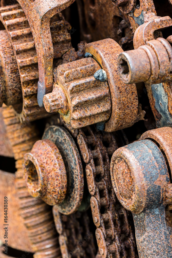 old rusty gear wheels. grunge metal machinery details closeup. old rusty gear wheels. grunge metal machinery details closeup.