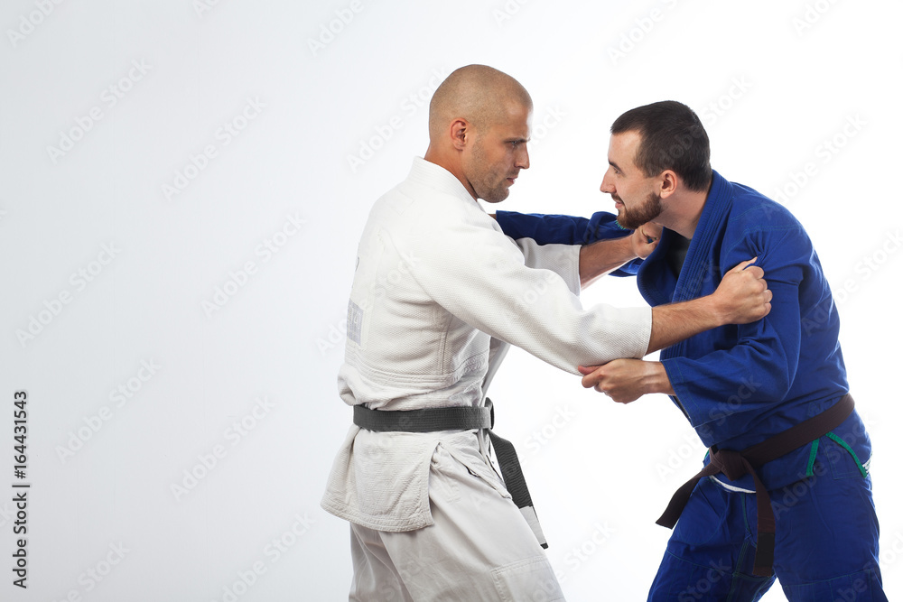 two men  fight judo