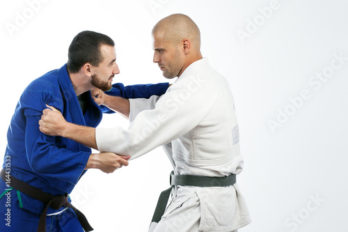 two men fight judo