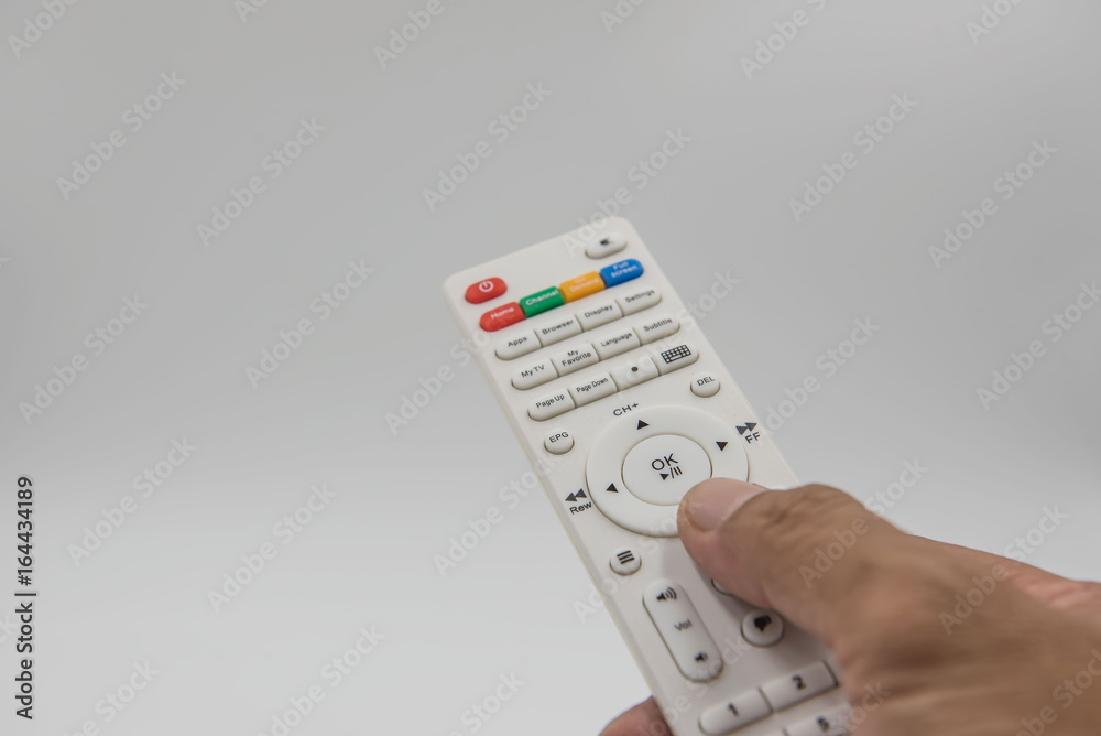 white remote control in hand on white background . white remote control in hand on white background .