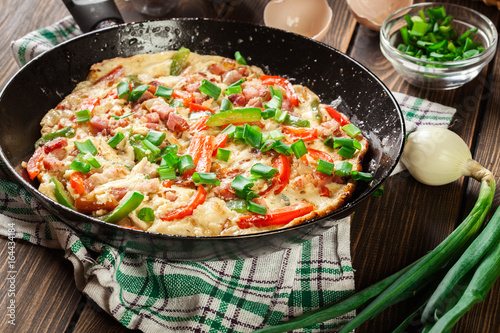 Fresh omelette with bacon and bell pepper