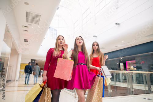 woman walking with shopping bags photo